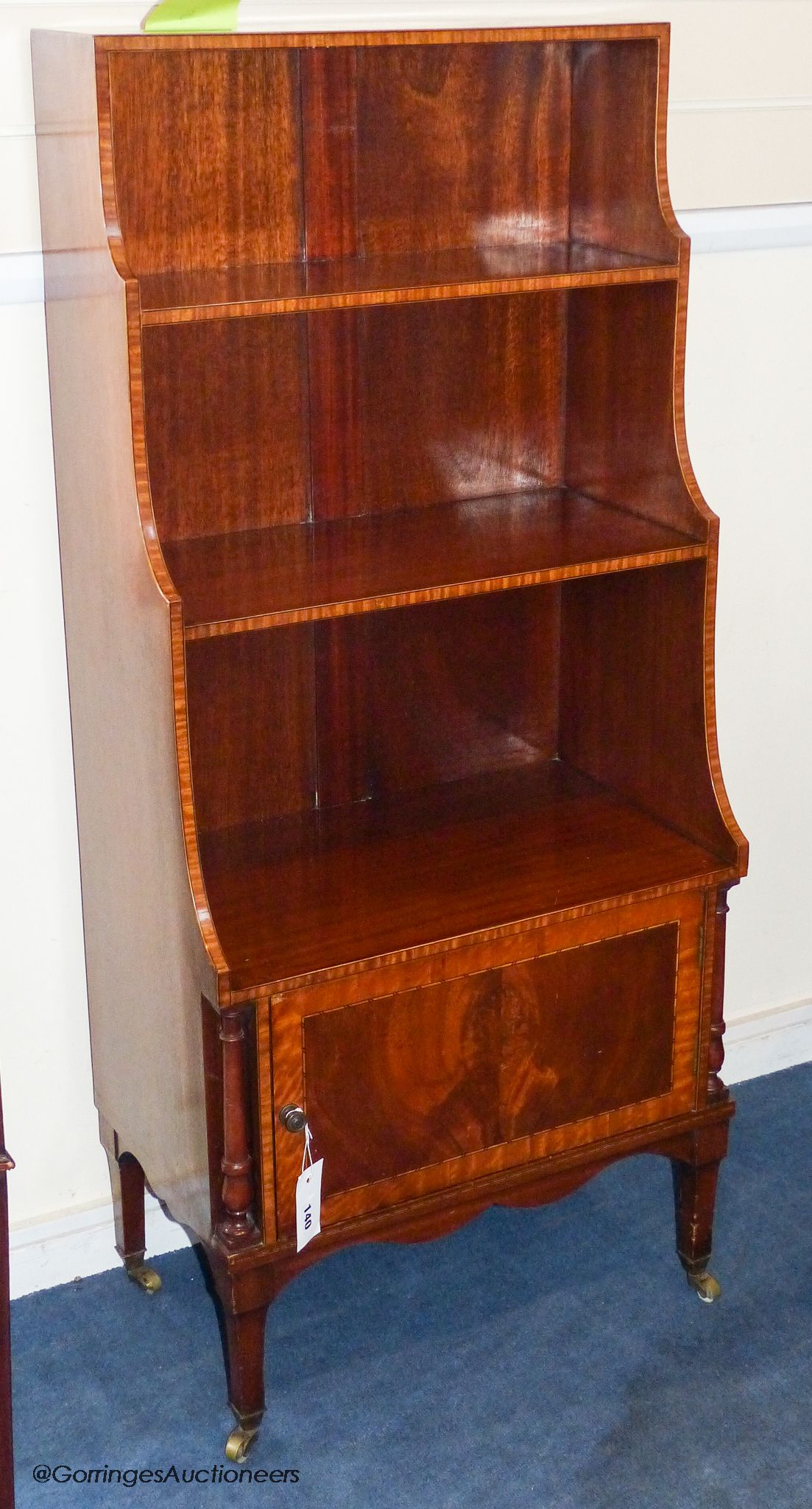 A Sheraton revival inlaid mahogany waterfall bookcase, 114.5 cm height, 51 cm wide, 30.5 cm deep